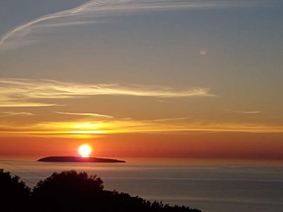 Sunset from my terrace towards the West over Puffin Island (Ynys Seiriol in Welsh).