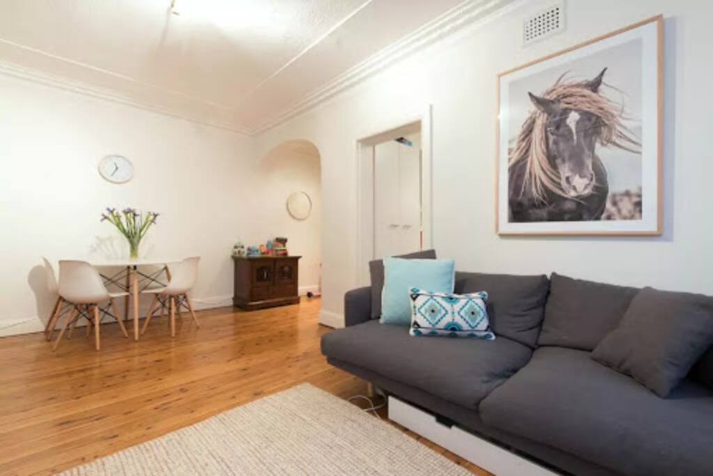 dining room/loungeroom original floor boards, high 12 ft ceilings and ornate ceiling.