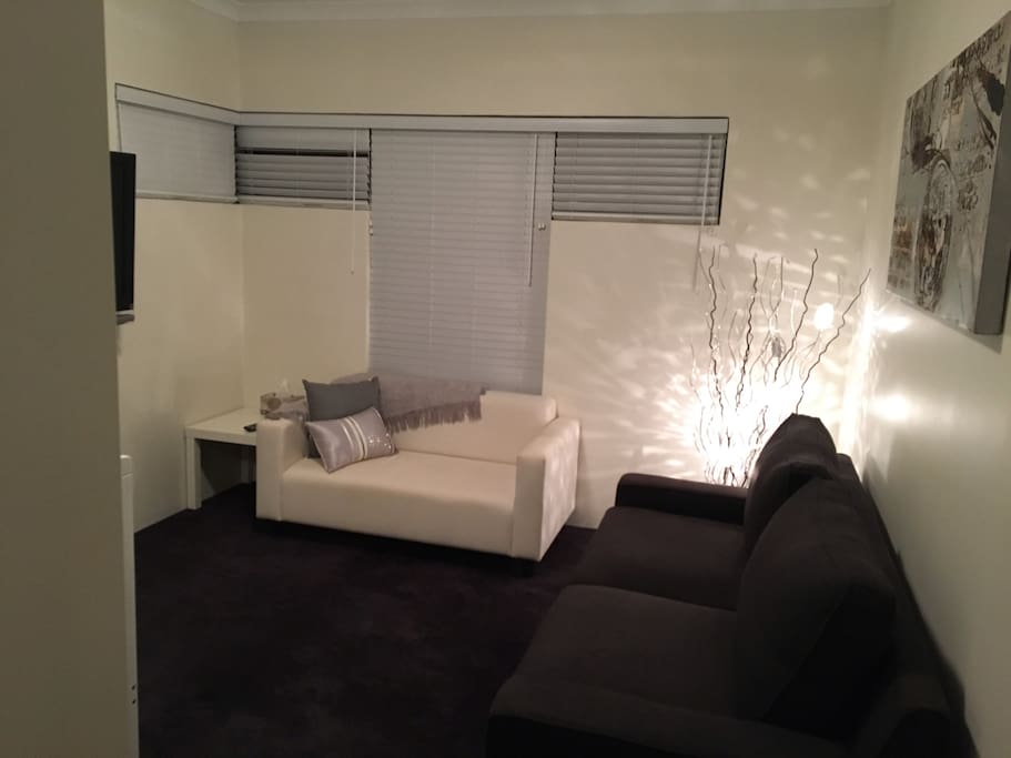 Living room with wall mounted 42" television