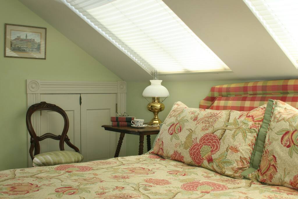 Detail of King room. Large roof windows flood room with light and provide views into the garden.