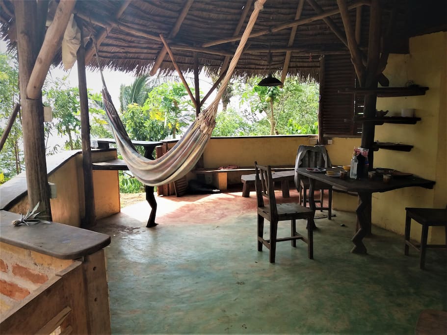 Living area with hammock, dining room table