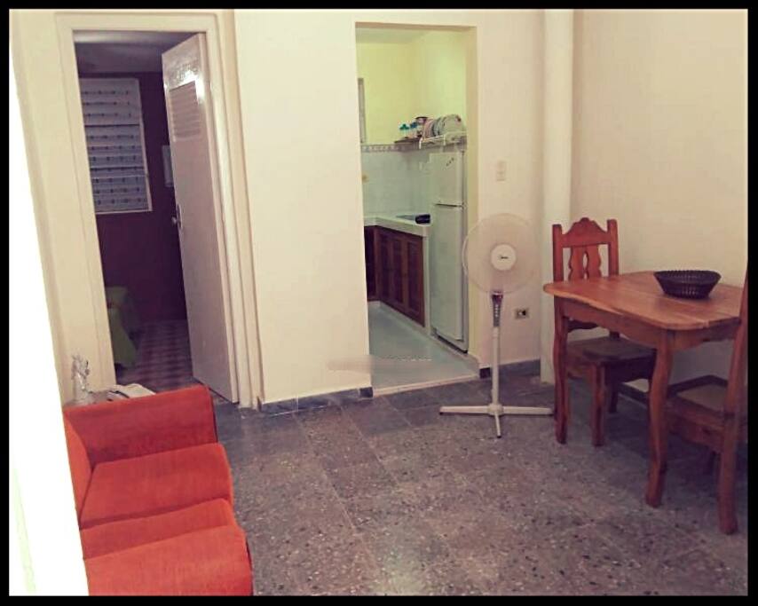 Living dinning room with TV and fan