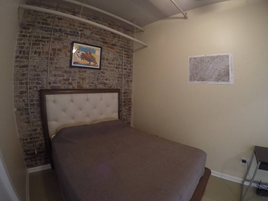 This will be your bed. It has clean sheets with a light comforter.