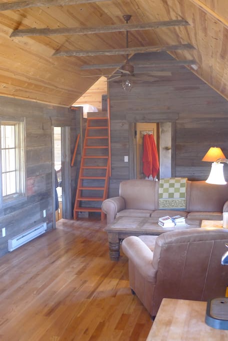 Living room with ladder to the sleeping loft