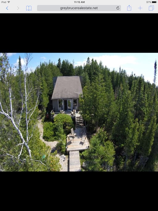 This is an arial view prior to a new roof (Sep 2017) new decking,railings and the addition of 6 Adirondack chairs.