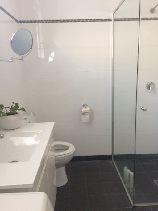 Bathroom with Shower and Washing Machine