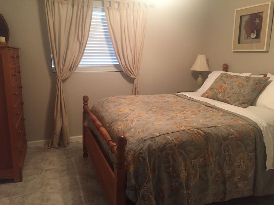 this is the master bedroom with a queen size bed its own TV and a separate entrance into the vanity area.this room also has a good size closet