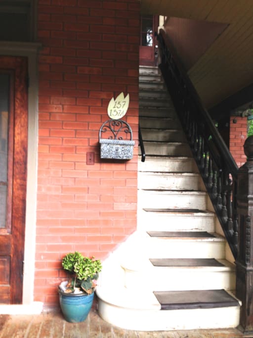 Our house's porch and the staircase that leads to airbnb apt.