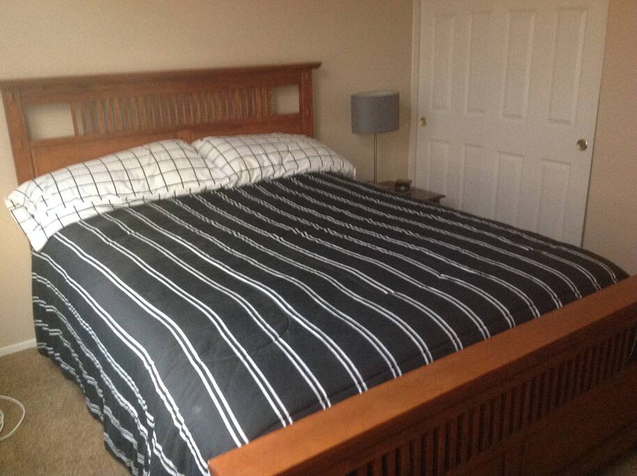 Bedroom number 2 offers a queen size bed with a full bathroom right outside the door across from Laundry.