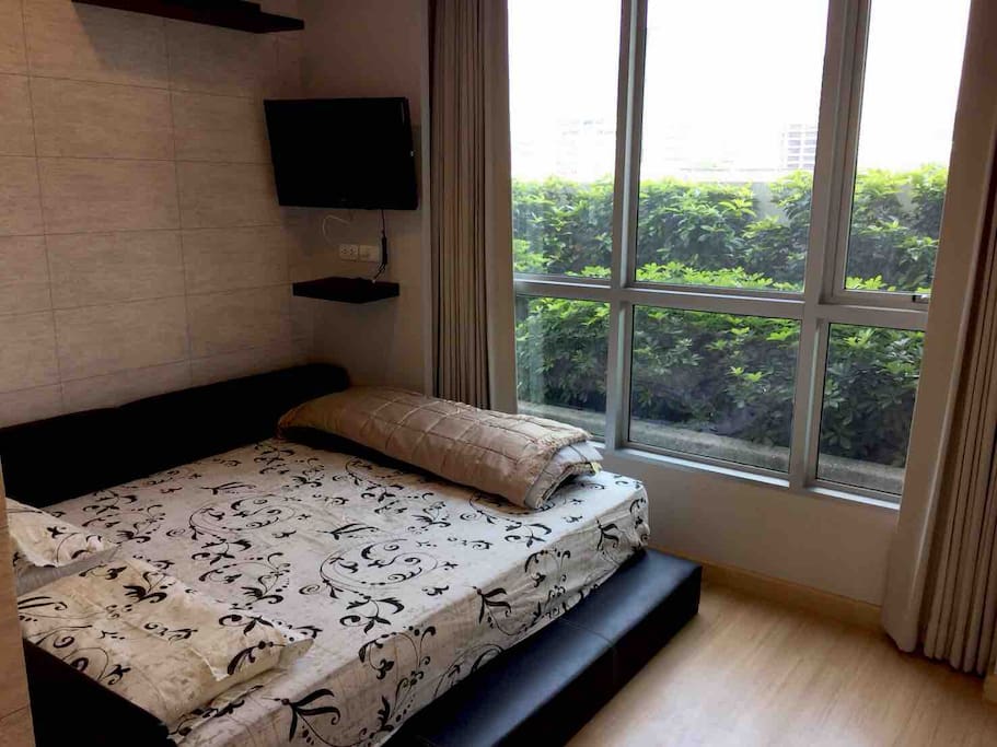 Garden and City View Bedroom