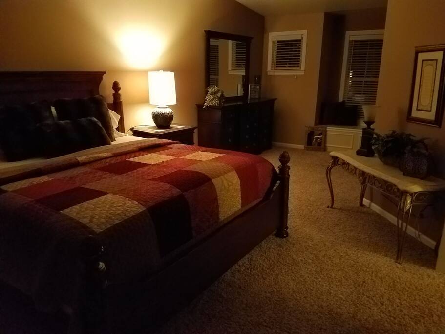 Master suite w king size bed, private bath, walk in closet and electric fireplace.
