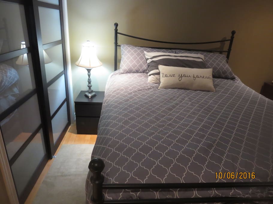 a king size bed with a closet.
