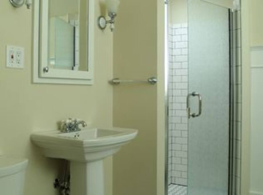 Bathroom with clawfoot tub and stand-up shower
