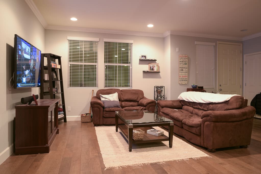Spacious living space with 60 inch tv and plenty of seating