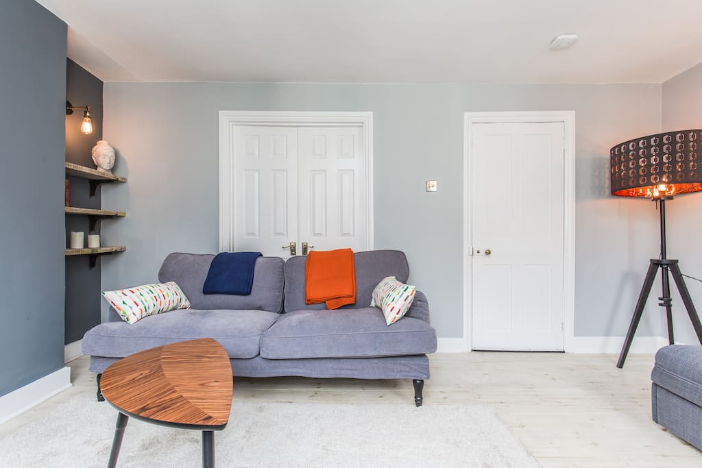 Bright space with comfy sofa's & throws for comfort.