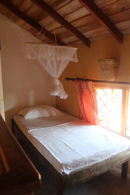 The mezzanine level with a single bed