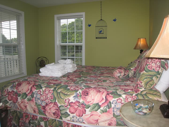 Third bedroom with king bed( luxury beautyrest pillow top firm mattress), windows 2 sides, cherry hardwood floors, dresser and wardrobe.