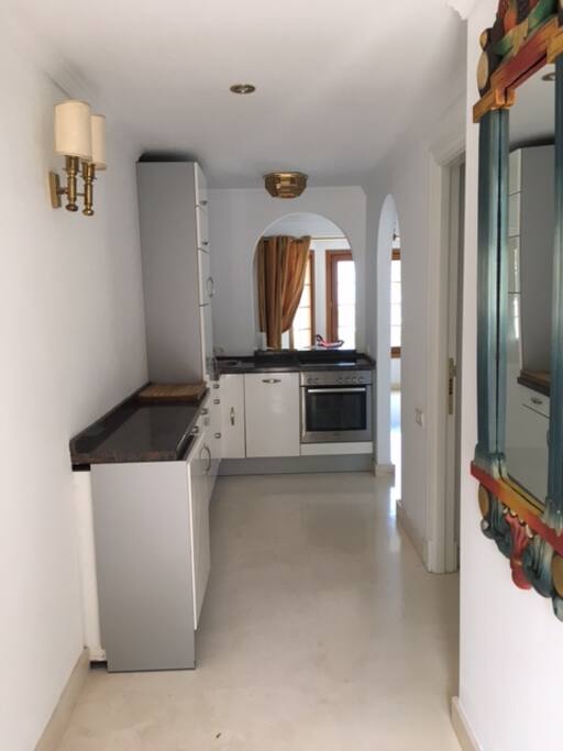 Entrance area with built-in kitchen