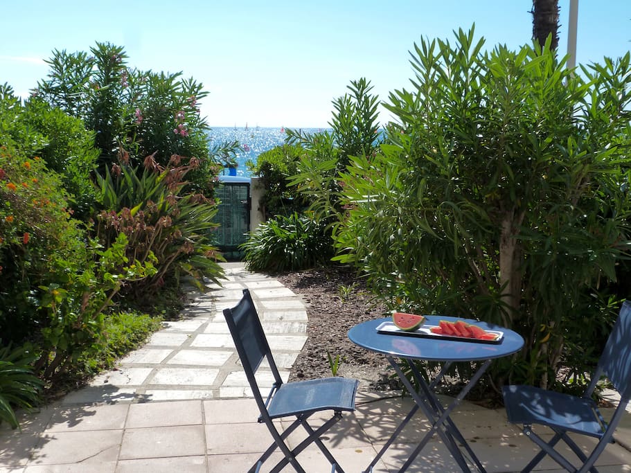 View from the living area, double sliding doors opens onto terrasse with outdoor table