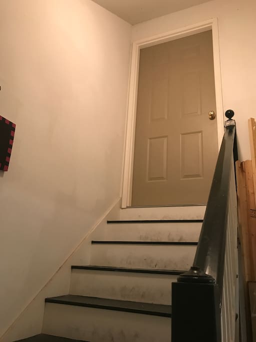 Stairs going up to apartment door