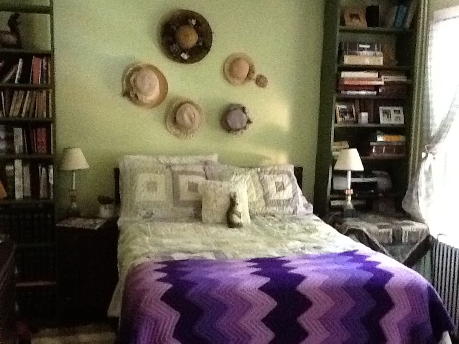 Canopy of trees outside this economy floor bedroom.