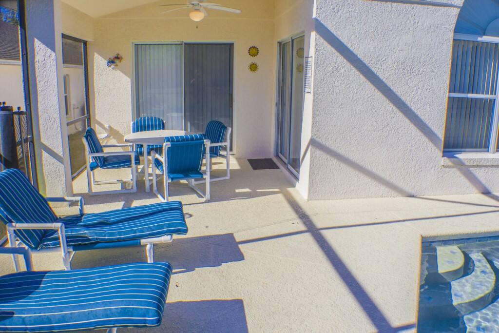 Pool Side Dining Under The Covered Lanai & Pool Side Loungers.
