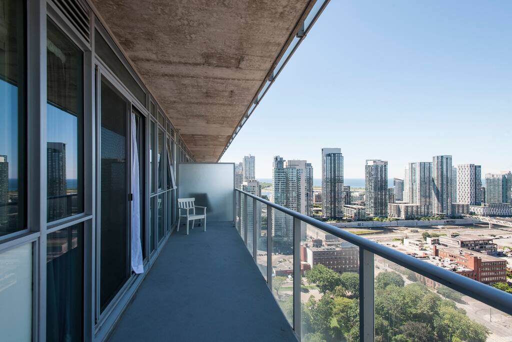 Oversized Balcony With Outdoor Chairs