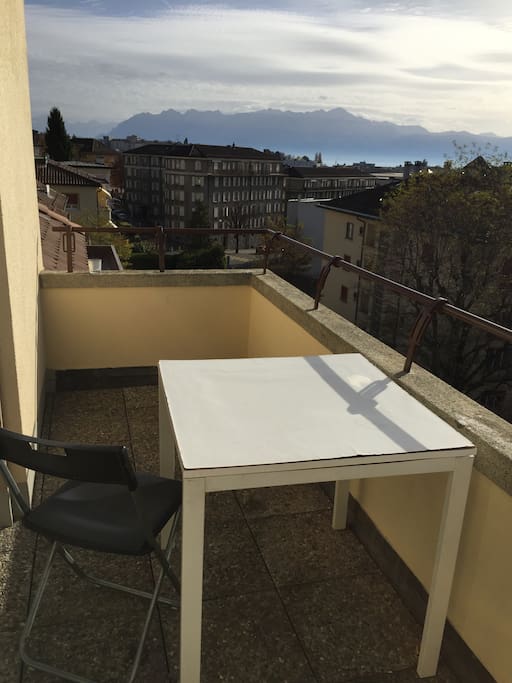 Terrace with view to the lake and alps.