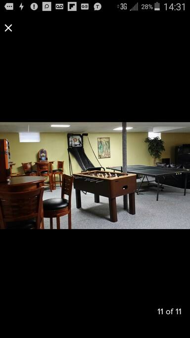 This lower level has the works!!! Huge HD TV, bar, poker table, ping pong table, fooseball, and more! Perfect gathering place for that special corporate retreat, family reunion and/or friends, old and new! Game on!!