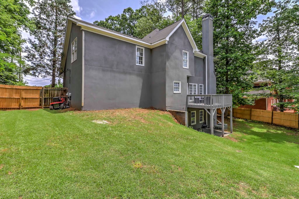 The home features a spacious, fenced-in backyard, perfect for kids.