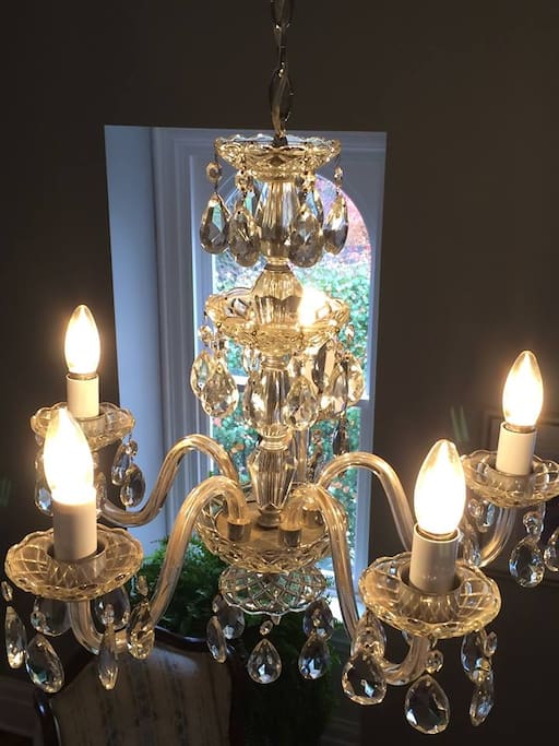 A pair of antique chandeliers inspired the name for the elegant Crystal Suite