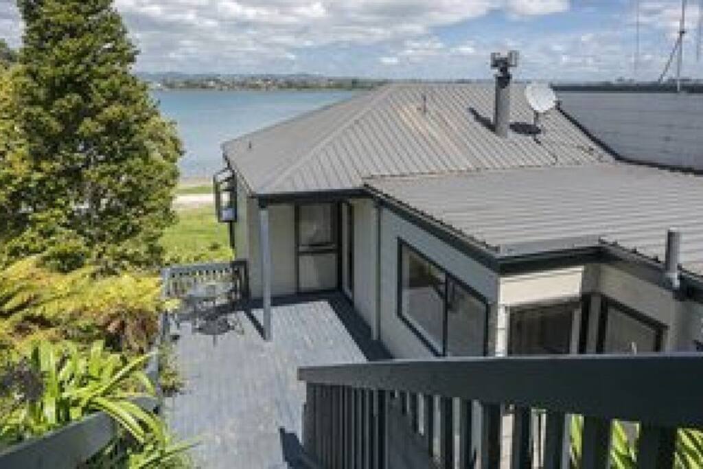 To access the house you walk down the stairs to this beautiful view. Front deck all day sun