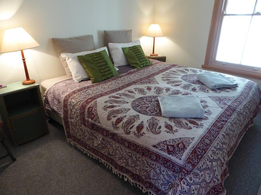 Large bedroom with TV and Ceiling Fan