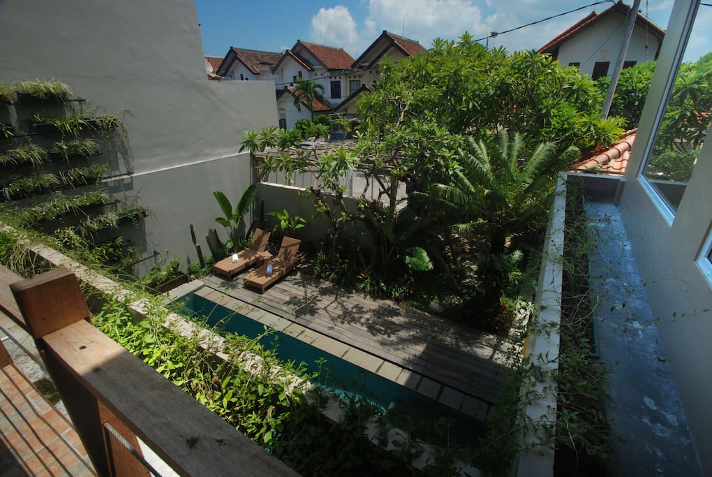 THE VIEW OF SWIMMING POOL FROM SECOND FLOOR