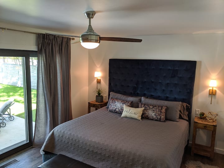 The Master Bedroom with direct access to the backyard from an entire wall of sliding doors