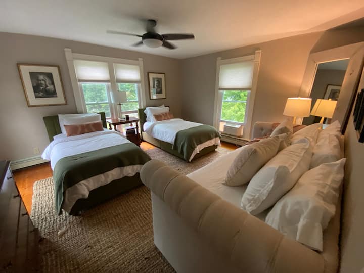 The second bedroom in the Master Suite is a beautiful, sun-filled room with two twin beds,  and luxury linens. Beds may be pushed together to make a king, upon request.  A beautiful daybed with trundle makes this room functional for kids or adults. 