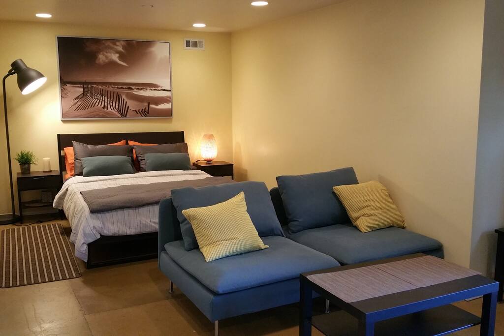 New (queen) bed with movable couch for a 3rd guest sleeping.