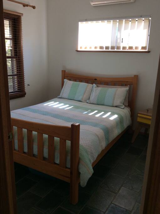 Built I wardrobe with bobble glass mirrors, air con