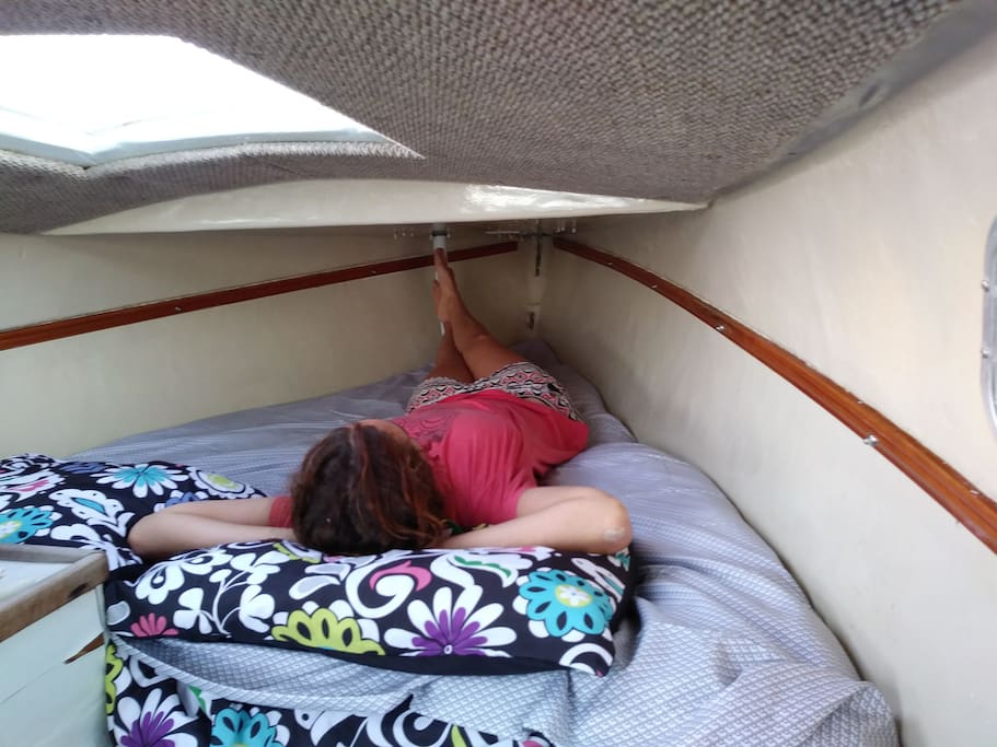 Bed fits one person comfortably, two at most. Notice the open hatch/sky light