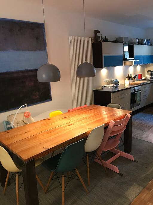 Dinner table connected to open kitchen