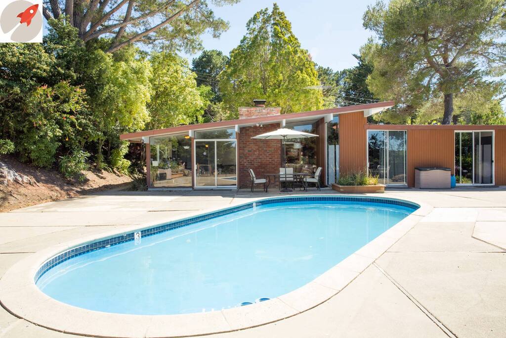 The backyard with pool and patio