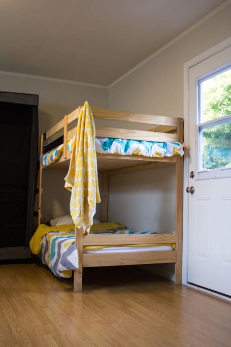 Residents sleep in four-person and six-person bedrooms. Each bunk comes with underbed storage bins, your own half-height closet space, and additional suitcase storage. All upper bunks have a bedside-table space.