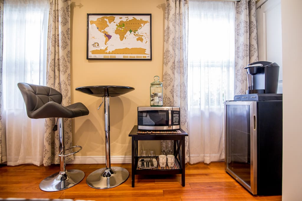 Mini kitchenette with refrigerator, microwave and coffee maker