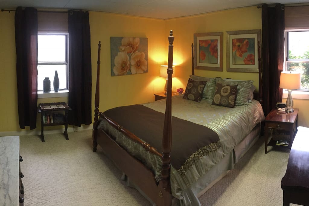 Cheerful queen bedroom with comfortable bed, large closet, overlooks private wooded yard