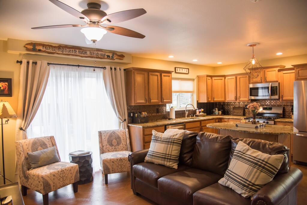 Open kitchen/living/dining area. Queen sleeper sofa with memory foam mattress in the living room.