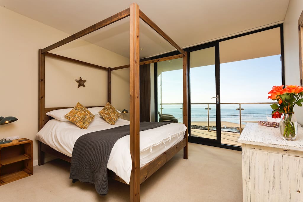 Master bedroom with luxury kingsize four poster bed