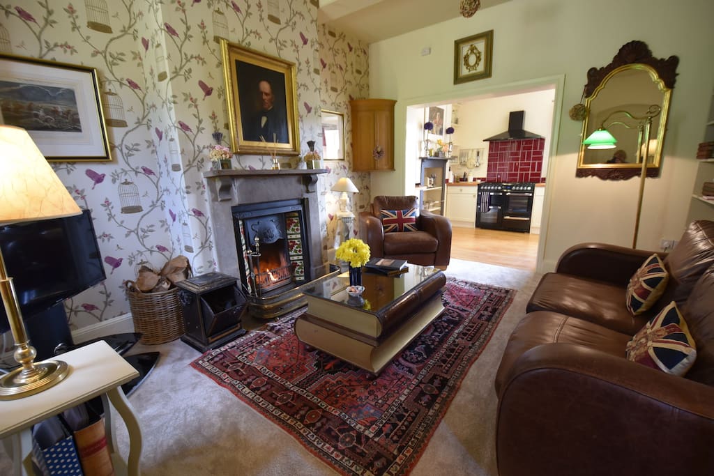 Downstairs sitting room with an open fire