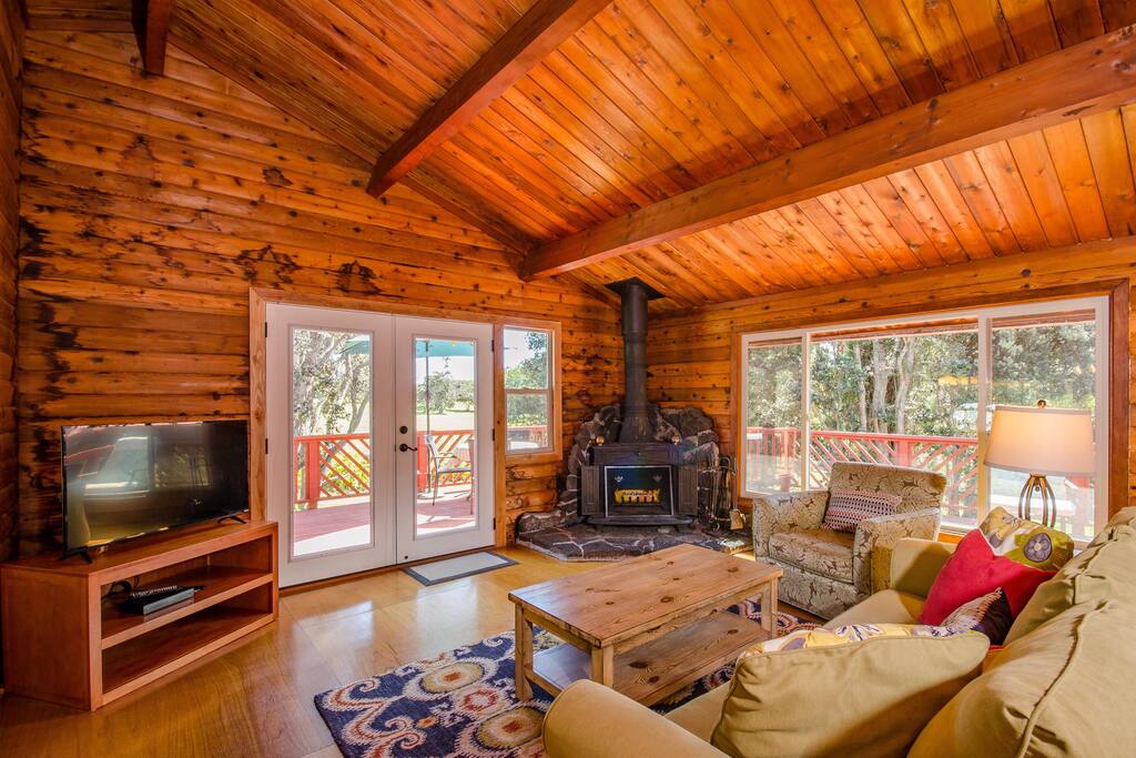 Looking from the living room out onto the large deck and beyond to the golf course. The house sits back from the course.