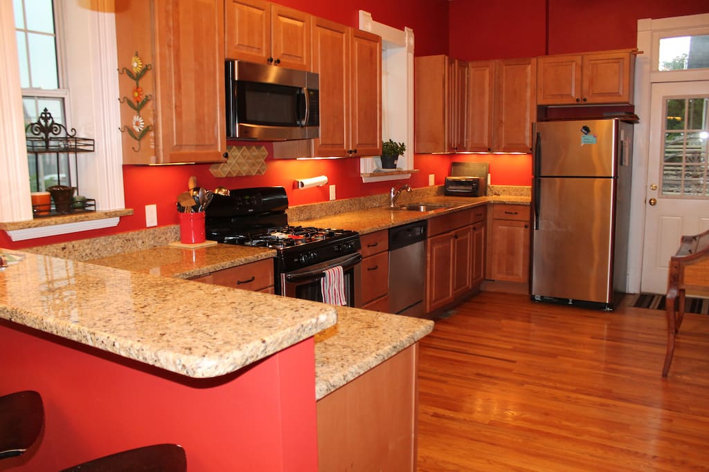 Spacious kitchen opens onto a private patio area.
