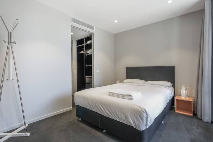 Prim and spotless white bedroom
